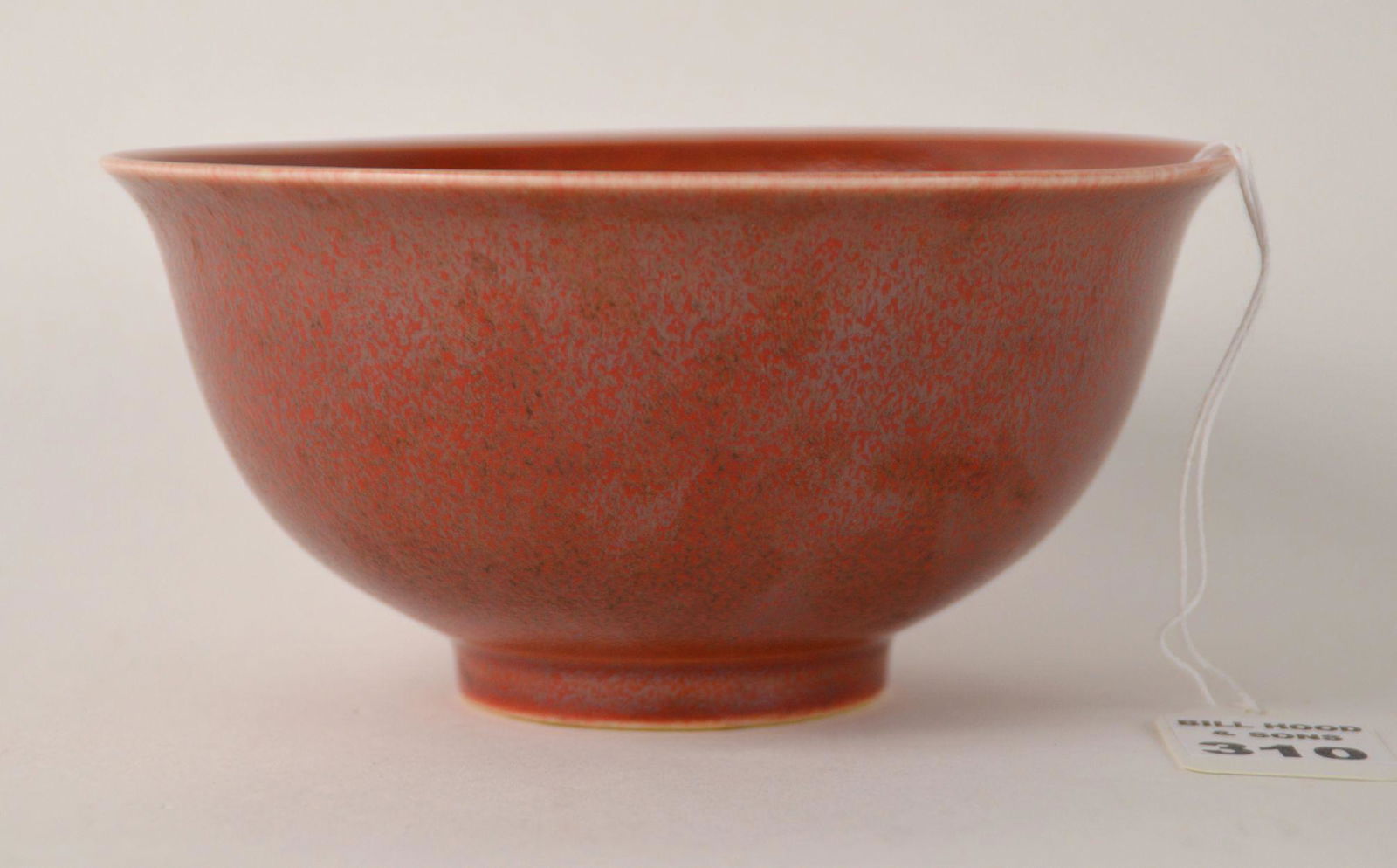 CHINESE SANG DE BOEUF GLAZED PORCELAIN BOWL -: CHINESE SANG DE BOEUF GLAZED PORCELAIN BOWL - Texturized red ox-blood glaze. Blue Kangxi mark on bottom of pedestal foot in blue underglaze. Dimensions: 3” H x 6” diameter. Condition: No damage id
