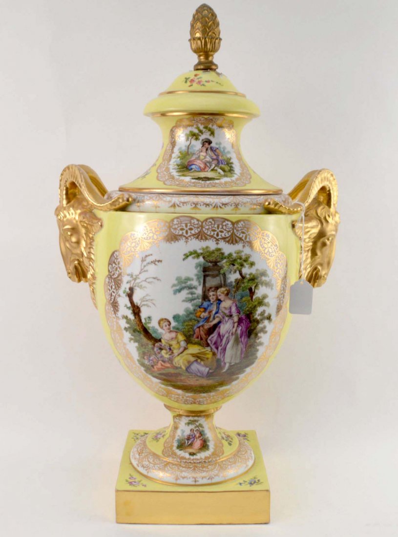 HELENA WOLFSOHN GERMAN PORCELAIN URN - Canary yellow: HELENA WOLFSOHN GERMAN PORCELAIN URN - Canary yellow urn features romantic courting scenes and goat handles in gilt. Fixed lid and drilled through, may have previously been electrified as a lamp. “D