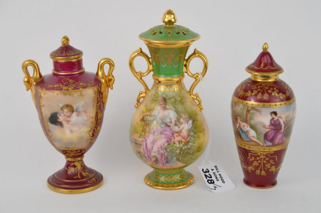 3 Vintage Small Royal Vienna Hand Painted Lidded Urns: 3 Vintage Small Royal Vienna Hand Painted Lidded Urns (6"h, 6 1/4"h & 7 1/4"h). The 6 1/4"h bolted urn signed "Loves Dream" others with Beehive Mark (few "dots" gilt missing)