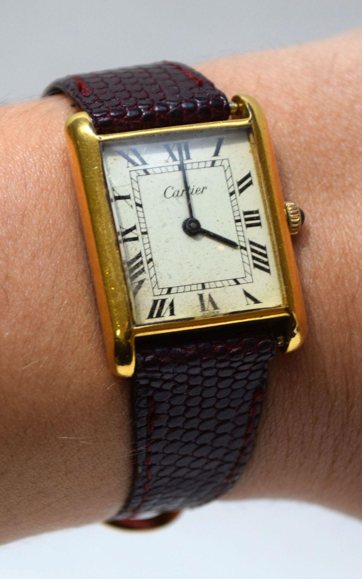 Cartier Ladies Gold Plated Watch G.20. with leather: Cartier Ladies Gold Plated Watch G.20. with leather band 5" with 2" opening. Condition normal wear needs service not working. 25mm x 22mm