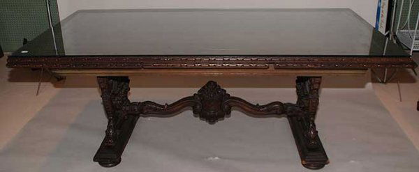 Dining table beautifully ornately carved mahogany: Dining table , beautifully ornately carved mahogany or walnut table base on large bun feet, ends extend with glass top, 78"L when closed