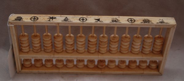Scrimshaw marine ivory abacus, 11" x 5": Scrimshaw marine ivory abacus, 11" x 5"