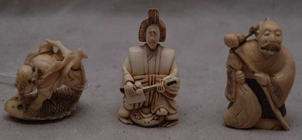 3 antique carved ivory Netsukes each artist signe: 3 antique carved ivory Netsukes, each artist signed, depicting a wise man, a man standing on a fish and a woman sitting on a frog, womans head is made as a nodder, good conditon