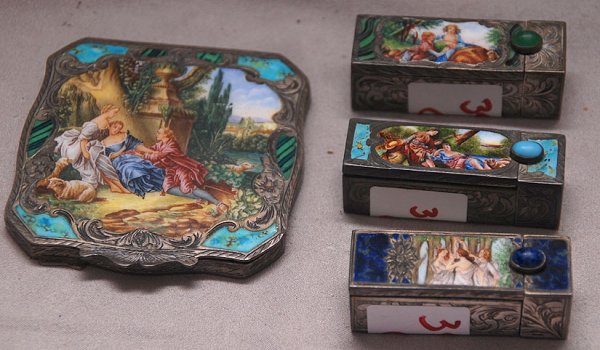 4 older enamel pcs incl; 3 compacts 2 1/4"h with f: 4 older enamel pcs incl; 3 compacts 2 1/4"h with figural scenes & powder compact, 3" x 3" (mirror is cracked)