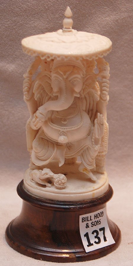 Ivory elephant seated under umbrella on 1" attache: Ivory elephant seated under umbrella on 1" attached wood stand, elephant is 4"h