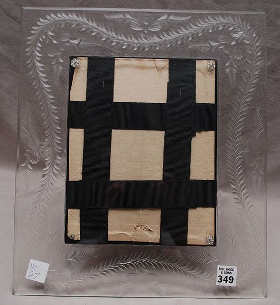 Glass frame with engraved garland