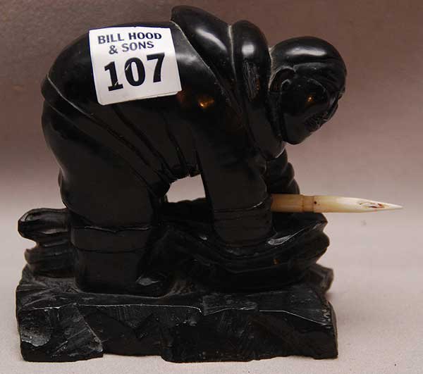 Early Argillite or stone sculpture carved by Inuit: Early Argillite or stone sculpture carved by Inuit artist. Depicting Hunter with Ivory spear. 6" x 4 1/2".