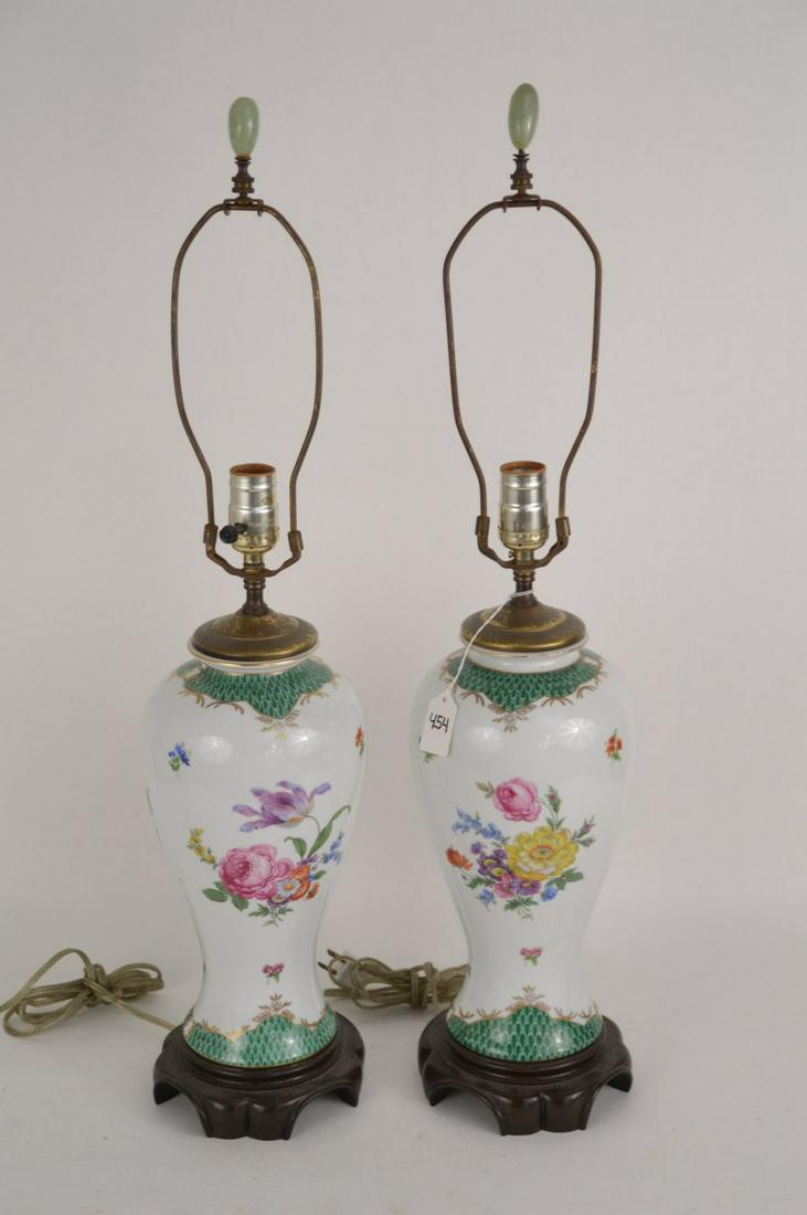 PAIR OF EUROPEAN PORCELAIN VASES NOW ELECTRIFIED AS: PAIR OF EUROPEAN PORCELAIN VASES NOW ELECTRIFIED AS LAMPS - Florals on a white ground with top and bottom borders of green feather design. Jadeite finials. Wood base. Dimensions: Height to socket - 18