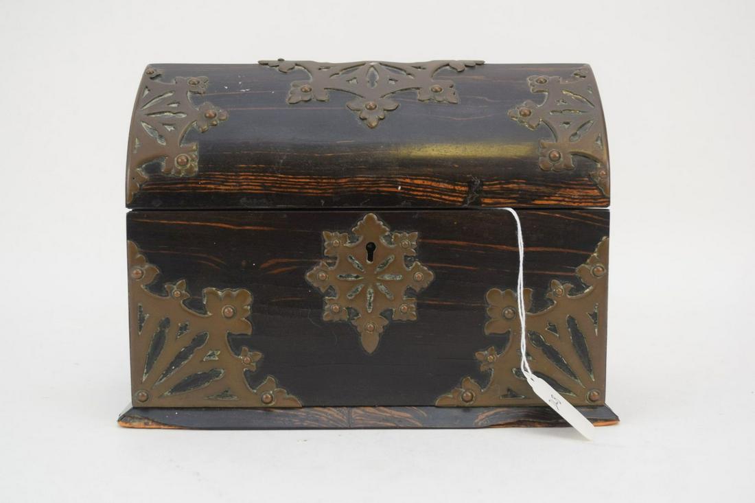 ANTIQUE CORAMANDEL WOOD AND BRASS DOMED BOX - Wood box: ANTIQUE CORAMANDEL WOOD AND BRASS DOMED BOX - Wood box with snowflake shaped brass medallions. Padded blue silk interior lid. 7" H x 9 1/2" L x 5 1/4" D.