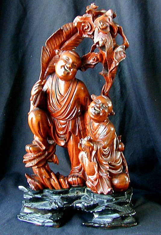 OLD CHINESE BOXWOOD SCULPTUREFinely carved figural: OLD CHINESE BOXWOOD SCULPTUREFinely carved figural sculpture of 2 laughing males amongst a background of tropical foliage with bats, 12"H.
