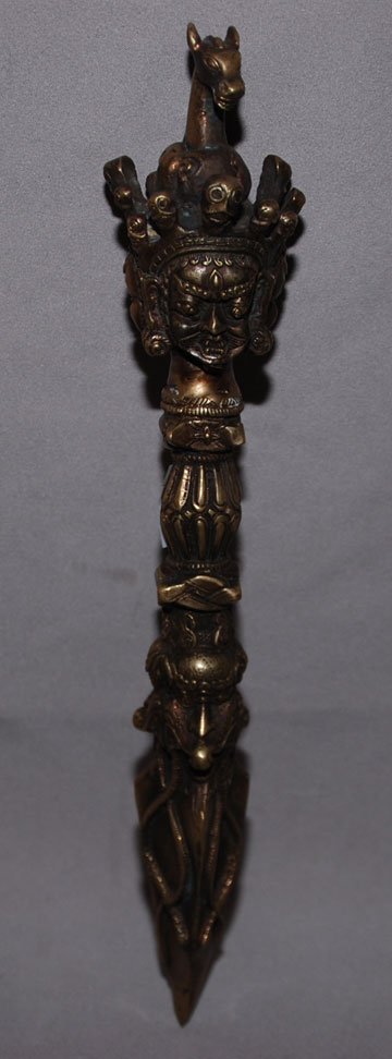 Tibetan unconventional figural weapon with 4 faces: Tibetan unconventional figural weapon with 4 faces at handle, 12"L