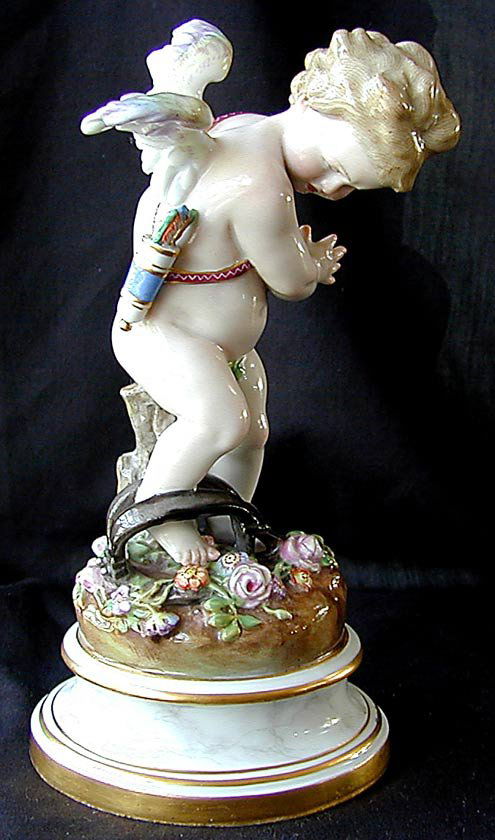 19THC MEISSEN FIGURINE 7.25"h "Angel In a Bear Tra: 19THC MEISSEN FIGURINE 7.25"h "Angel In a Bear Trap", blue crossed swords mark under glaze, good condition, minor chip to base & flower