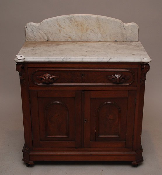 19th century 1 drawer 2 door marble top table with: 19th century 1 drawer 2 door marble top table with 2 holes drilled in back of marble, probably for a mirror 32"H x 33"L x 17"W