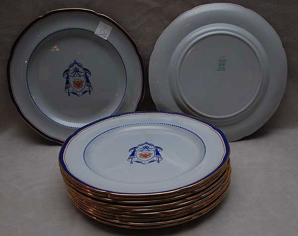 Set of 12 Copeland Spode U.S. Eagle Shield dinner: Set of 12 Copeland Spode U.S. Eagle Shield dinner plates, each 10 & 3/8 inches diameter. Blue and orange decoration with hand painted gilt details. Each marked with "Copeland Spode—England—New Sto
