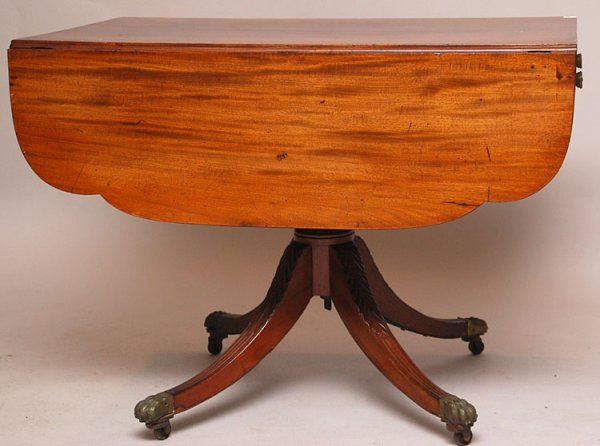 Mahogany drop leaf circa 1830's table with shaped : Mahogany drop leaf circa 1830's table with shaped leaves and single drawer on center pedestal with carved acanthus leaf design leading to 4 down swept legs, 29 1/2"h