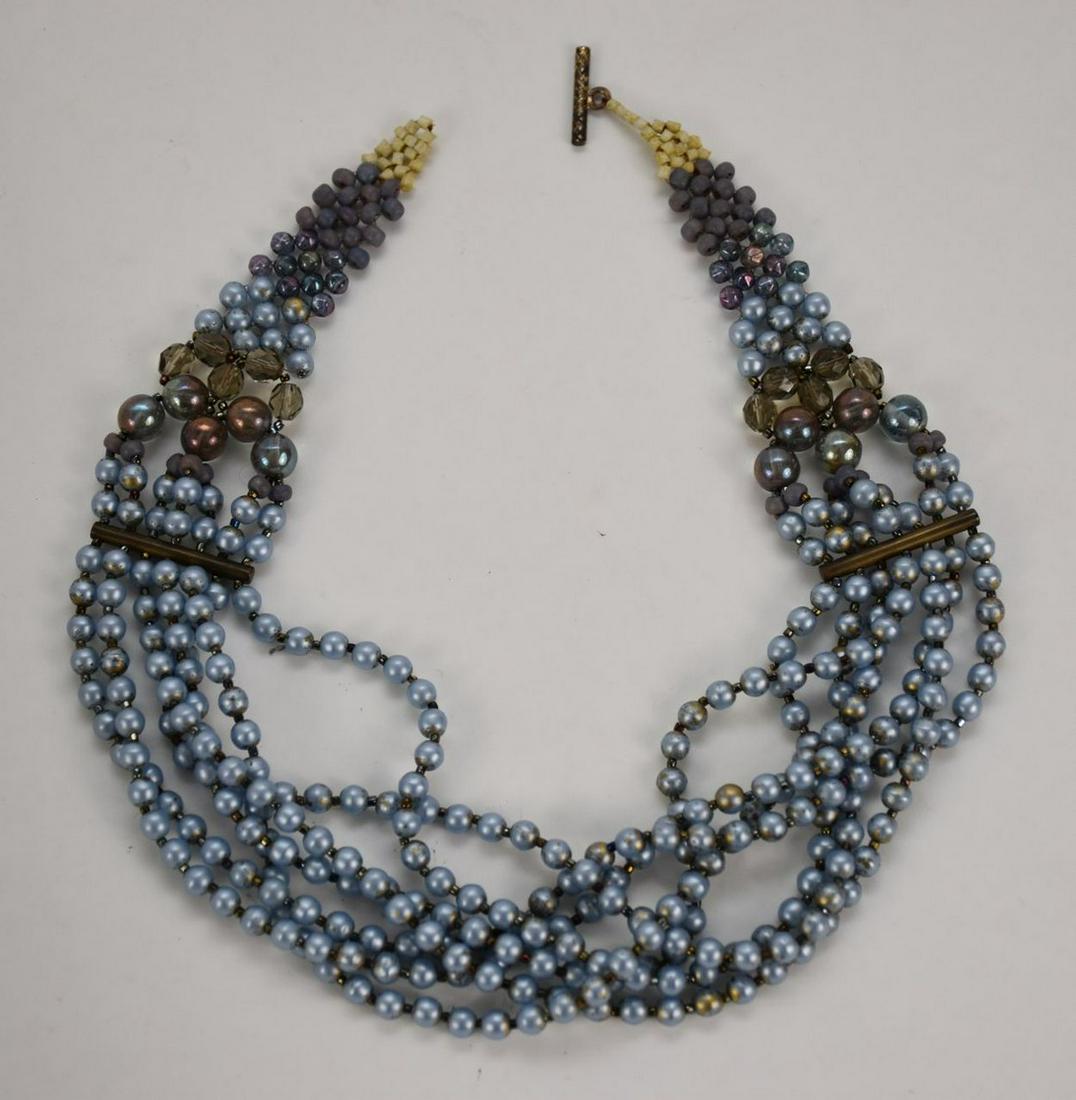 Giorgio Armani Rare Twist Fashion Necklace, seven rows: Giorgio Armani Rare Twist Fashion Necklace, seven rows of gray faux pearls with crystal accents. Excellent condition. Measures 20 in. long. Original box.