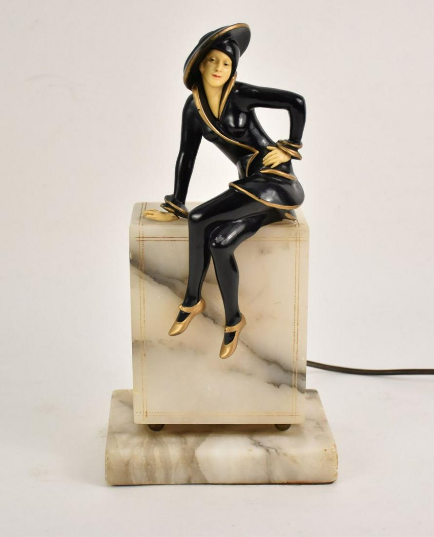 Vintage Deco Sculpture - Lady figure seated on: Vintage Deco Sculpture - Lady figure seated on Alabaster base - illuminates from behind. 12-1/2 x 6 inches, few chips to paint - one on knee and couple on hat and minor ware to alabaster base.