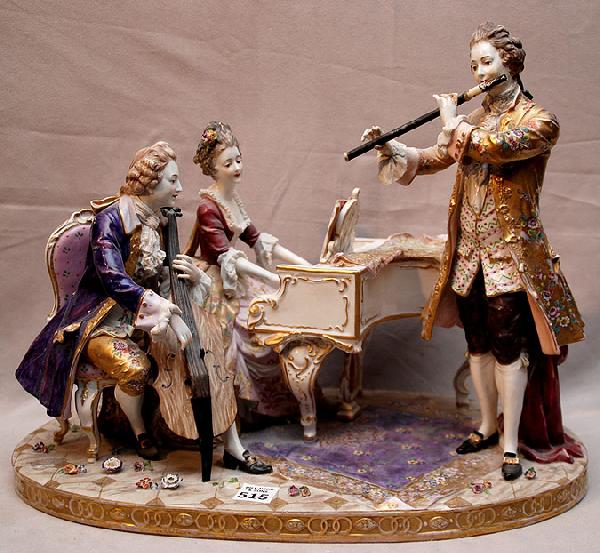Porcelain group, 3 musicians at piano detailed car: Porcelain group, 3 musicians at piano detailed carpet and piano shawl, painted clothing, 18"w x 14"h