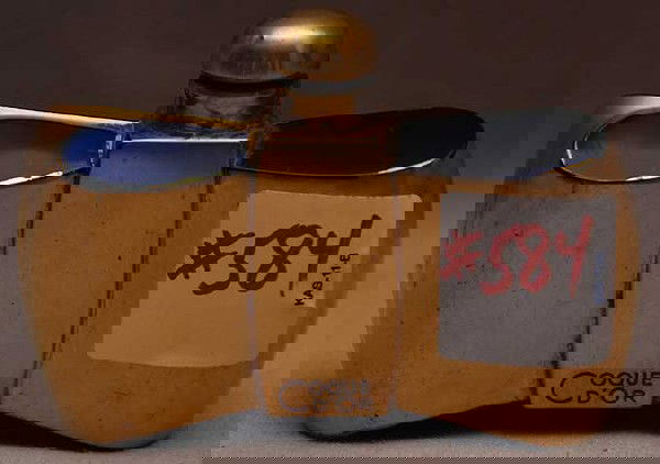 Guerlain "Coque D` Or" bow shape perfume bottle wi: Guerlain "Coque D` Or" bow shape perfume bottle with cobalt glass and gold, made in France, 3"h x 3 1/2"w