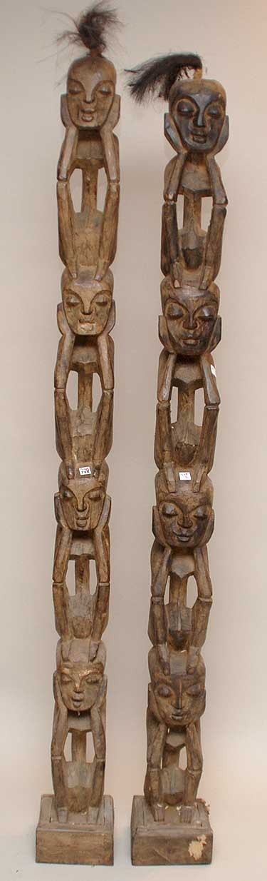 Pair of tall African carved wood heads (4) on pede: Pair of tall African carved wood heads (4) on pedestal type presentation, 80"h