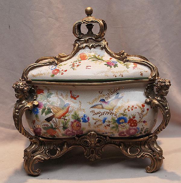 Large bronze and porcelain covered box with gilded: Large bronze and porcelain covered box with gilded bronze, figural children and mounts
