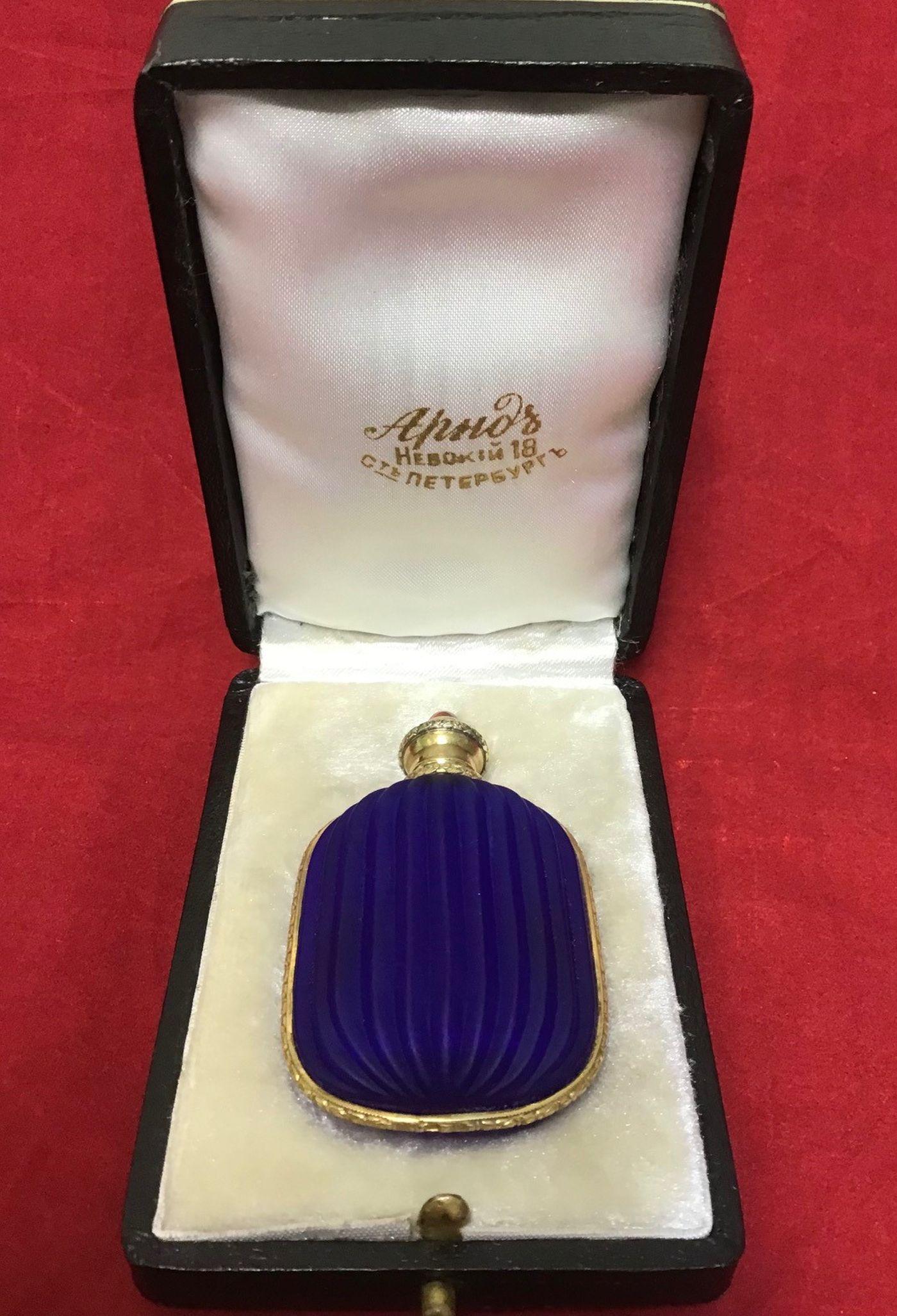 Russian antique silver perfume bottle -Russian silver: Russian antique silver perfume bottle -Russian silver blue glass with cabochon of ruby perfume bottle stamped 88 and maker mark . 1.5 in. x 2.7 in.