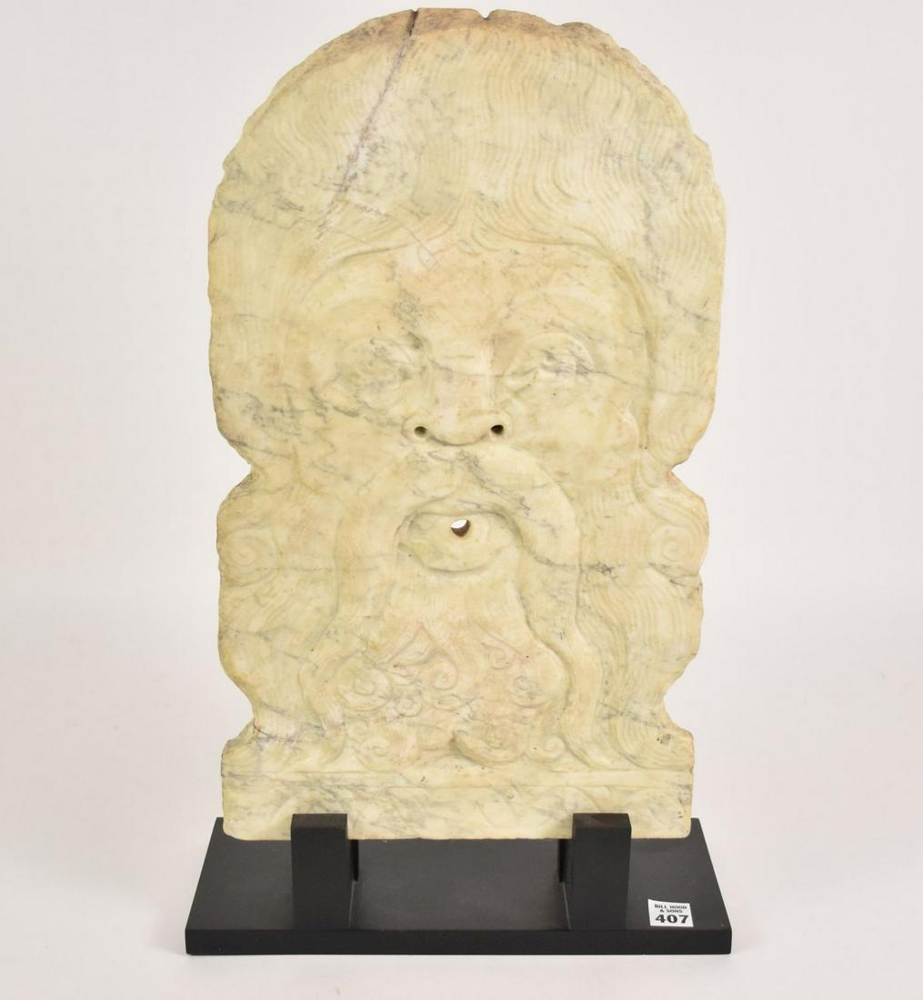 An Ottoman Empire Figural Marble Water Spout - C. 19th: An Ottoman Empire Figural Marble Water Spout - C. 19th century, Turkey. In the form of a male with curly hair, beard, and long mustache. Central void in mouth for water fountain. Marble - 18 3/4" x 11