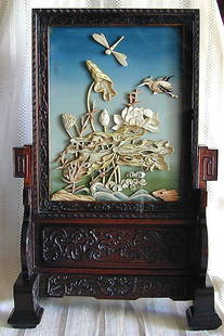 FINELY CARVED ANTIQUE CHINESE TABLE SCREEN A finel: FINELY CARVED ANTIQUE CHINESE TABLE SCREEN A finely carved antique ivory Chinese table screen w/ polychromed ivory forms of naturalistic dragonfly, bird, gourd, lotus and waves against a subtly colore