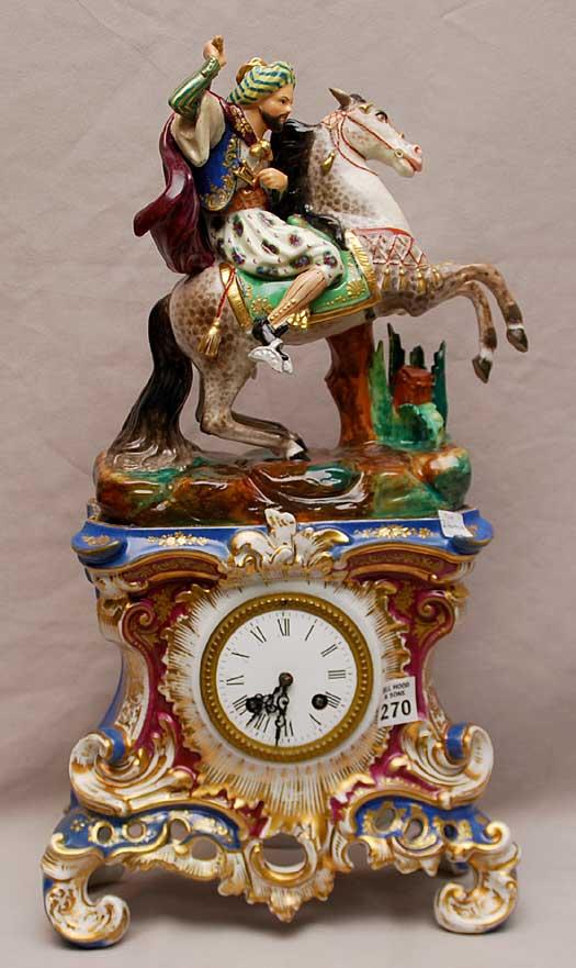 2 pc French figural porcelain clock depicting Arab: 2 pc French figural porcelain clock depicting Arabian horse & rider atop, Jacob Petit style, Paris, 20"h (professional repairs)
