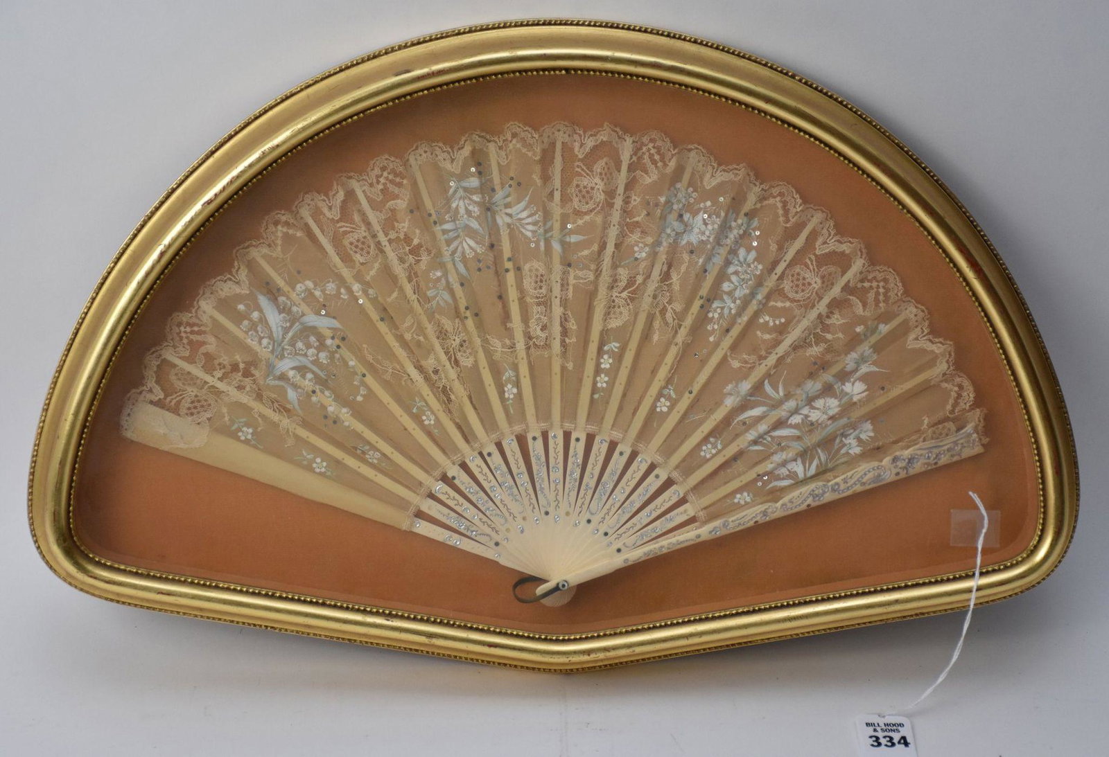 Framed Antique Hand-Painted Florals Fan - Cream-colored: Framed Antique Hand-Painted Florals Fan - Cream-colored folding fan of a sheer material and hand-crafted lace. Handpainted with delicate florals and tiny silver sequin accents. Carved bone sticks with