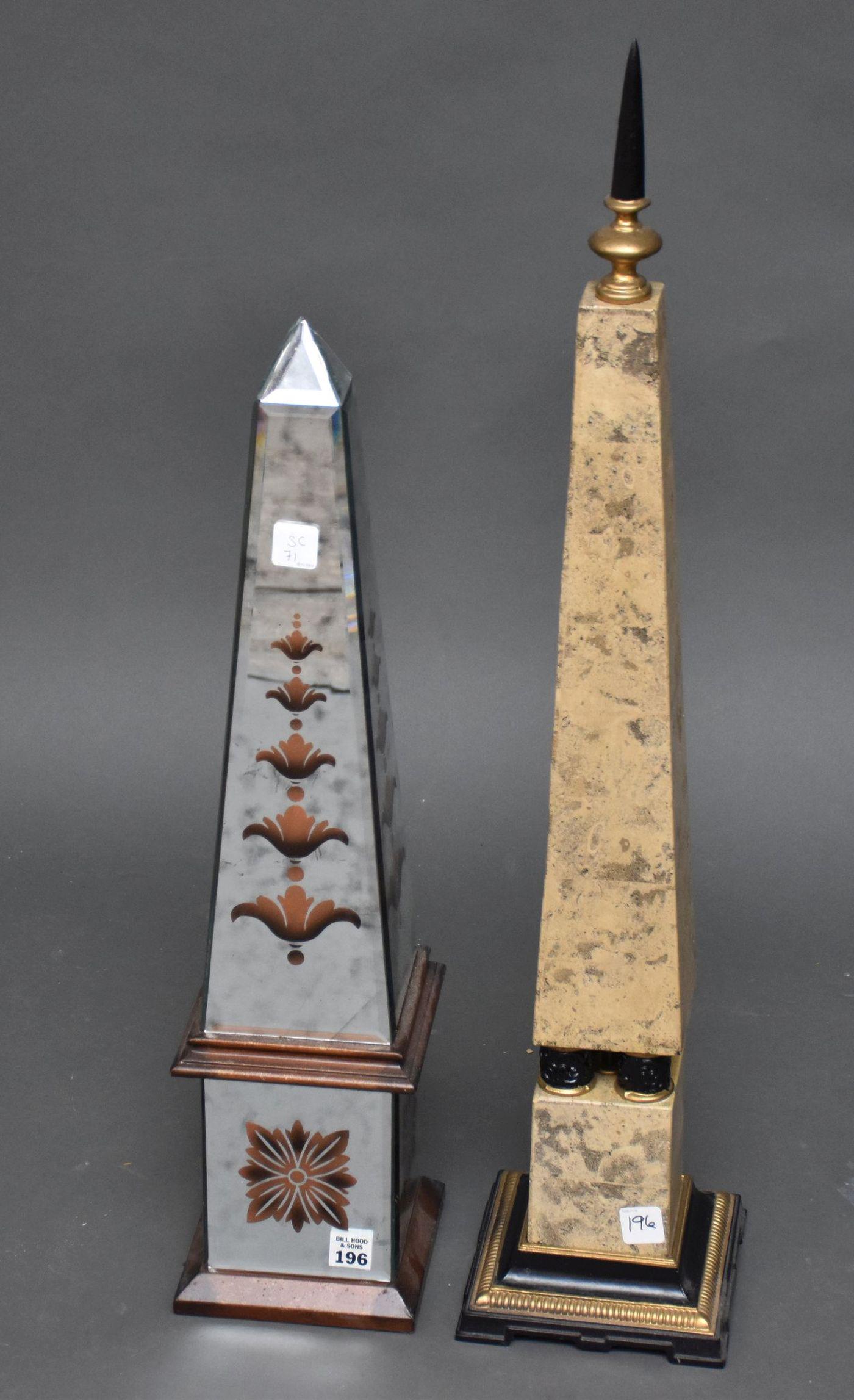 2 Decorative Obelisks, One Mirrored, One Faux Stone -: 2 Decorative Obelisks, One Mirrored, One Faux Stone - Faux stone - 31 1/4" h, Mirrored - 24 3/4" h, has chip to tip.