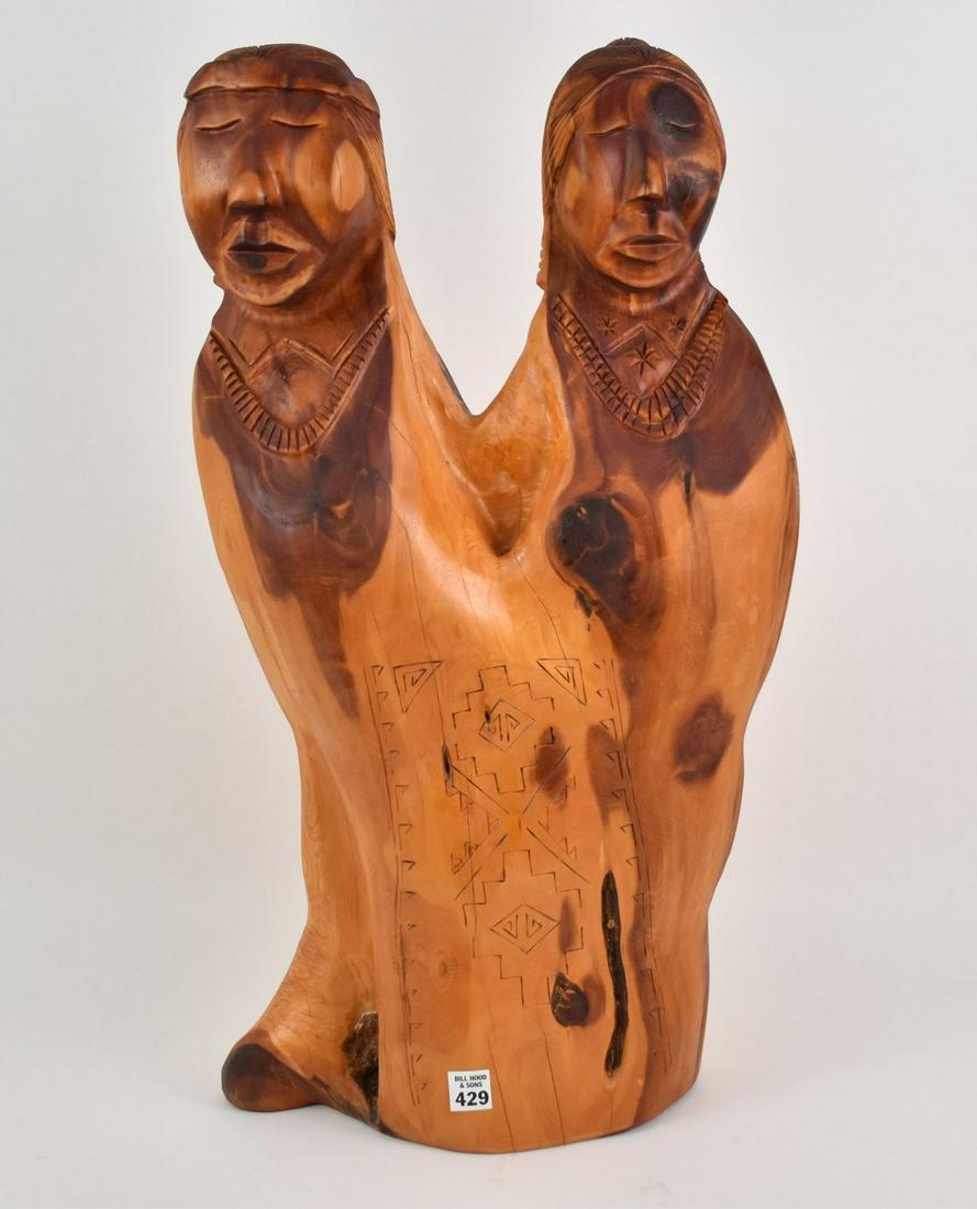 Harry Benally NAVAJO Carved Wood Sculpture "Dine Lady": Harry Benally NAVAJO Carved Wood Sculpture "Dine Lady" 2007 - A wood carving sculpture of two women by Navajo artist Harry Benally. This piece of wood was chosen for this piece, as it displays a natur