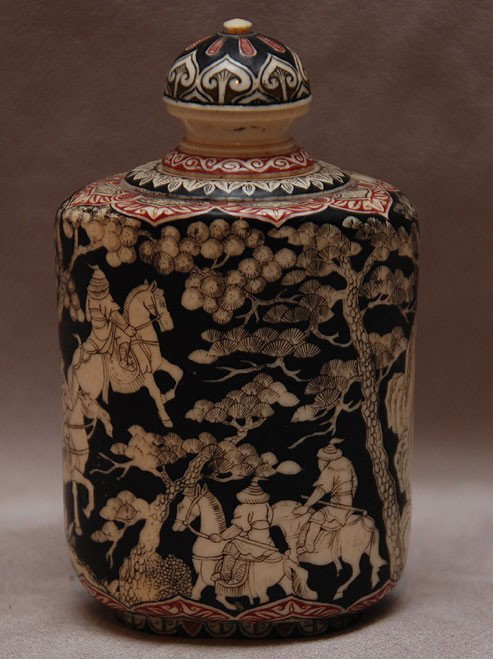 Rare old Chinese ivory snuff bottle with black gr: Rare old Chinese ivory snuff bottle with black ground and overall intricate design depicting horses, warriors and carriage, 4 1/4"h
