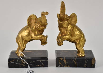 LOUIS FONTINELLE (1886-1964) DORE BRONZE ELEPHANT BOOKENDS - 20th Century, French. Circa 1930. Art: LOUIS FONTINELLE (1886-1964) DORE BRONZE ELEPHANT BOOKENDS - 20th Century, French. Circa 1930. Art Deco bronze doré elephant bookends. Each on hind legs with marble bases. H. 7” X W. 3” X D. 2”