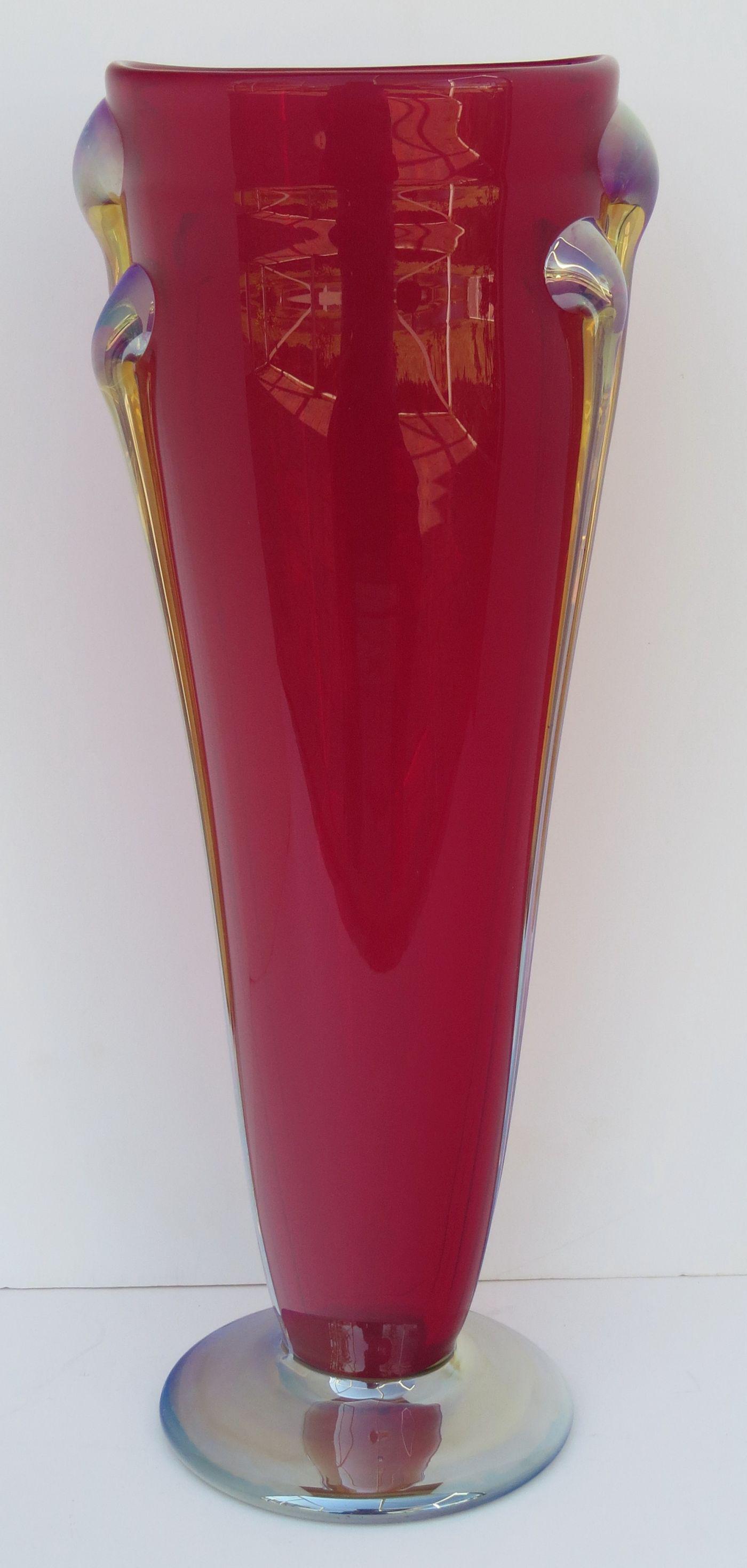 JOHN COOK Hand Blown Studio Art Glass Vase; Brilliant Ruby Colored Body with Gold Color Iridescent: JOHN COOK Hand Blown Studio Art Glass Vase; Brilliant Ruby Colored Body with Gold Color Iridescent Trim and Base; Six Applied Prunts near upper rim drawn down to vertical threads terminating above the