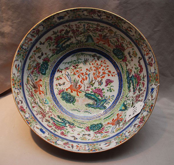 19th Century Famille Rose Punch Bowl. Interior d: 19th Century Famille Rose Punch Bowl. Interior decorated with winged lions, birds, butterflies and foliage. Condition: very good with minor normal wear. Dia. 15" Ht. 6 1/2"