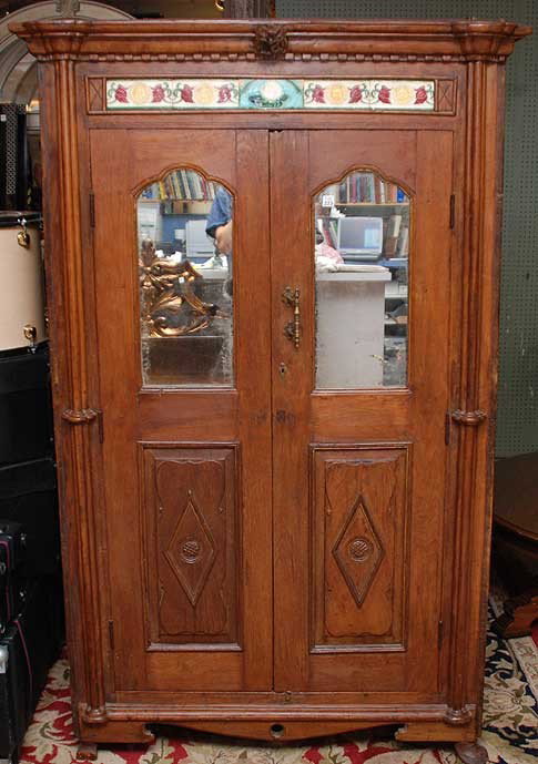 Continental cupboard with tile décor, over 2 mirro: Continental cupboard with tile décor, over 2 mirrored and paneled cabinet doors