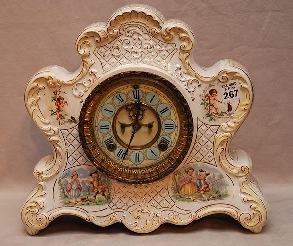 Shelf clock by Ansonia Clock Co, June 14, 1881, ti: Shelf clock by Ansonia Clock Co, June 14, 1881, time and strike original movement, enclosed in porcelain case in the French manner painted with genre scenes, 12"h, excellent condition