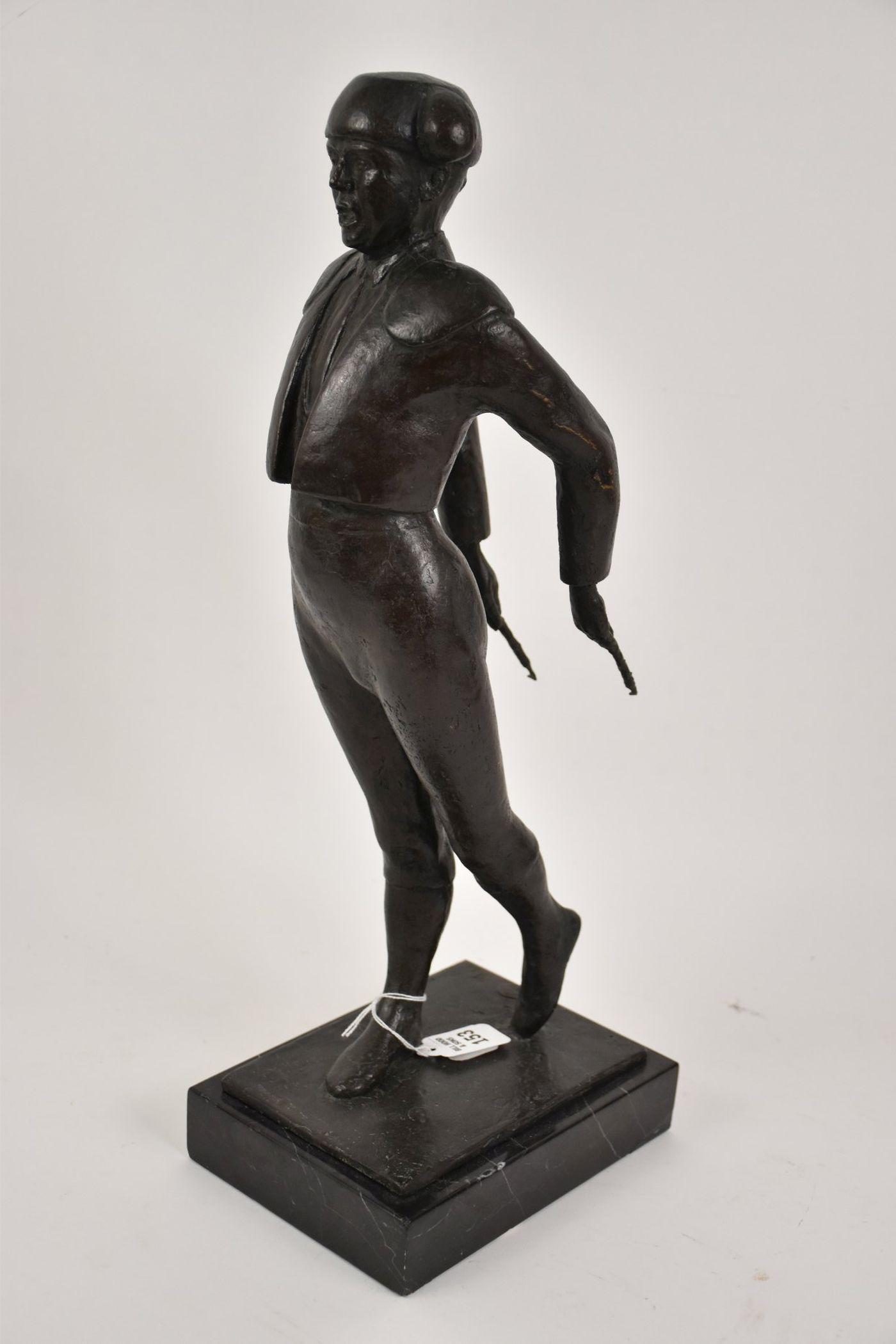 A Bronze Sculpture of a Matador - A bronze sculpture of a Matador/Bull Fighter holding two: A Bronze Sculpture of a Matador - A bronze sculpture of a Matador/Bull Fighter holding two banderillas (spiked darts) behind him. Marked with "FT?" mirrored monogram, an illegible round mark (possibly
