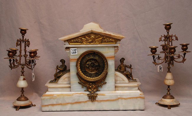 Onyx garniture set, clock with sentries and 2 smal: Onyx garniture set, clock with sentries and 2 small candelabras, 14"h x 16 1/2"w