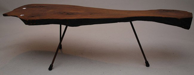 Carved log coffee table on 3 metal legs, 60"w x 17: Carved log coffee table on 3 metal legs, 60"w x 17"h