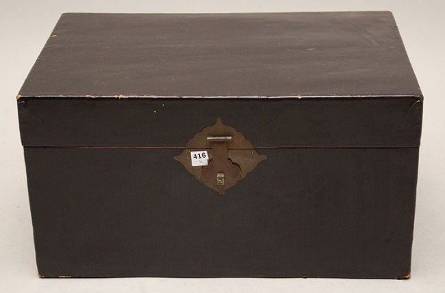 2 dark leather graduated size trunks with Asian fo: 2 dark leather graduated size trunks with Asian form bronze hardware, 16"h x 28"w x 19"d and 13"h x 25"w x 18"d
