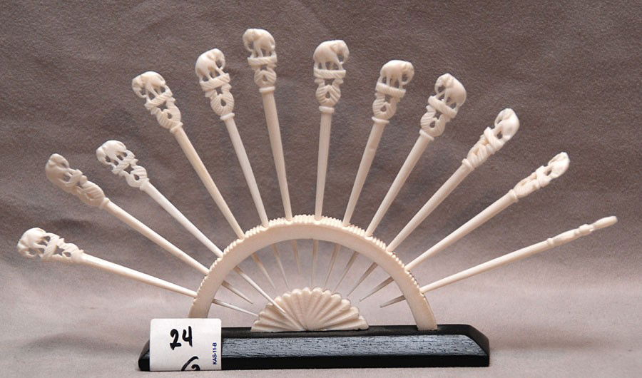 12 ivory toothpicks in holder and ivory handled bru: 12 ivory toothpicks in holder and ivory handled brush (7"L)
