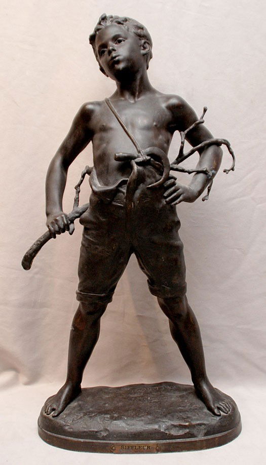 Bronzed lad holding limb behind his back: Antique Bronzed white metal lad holding limb behind his back, signed, 24"h x 14"w