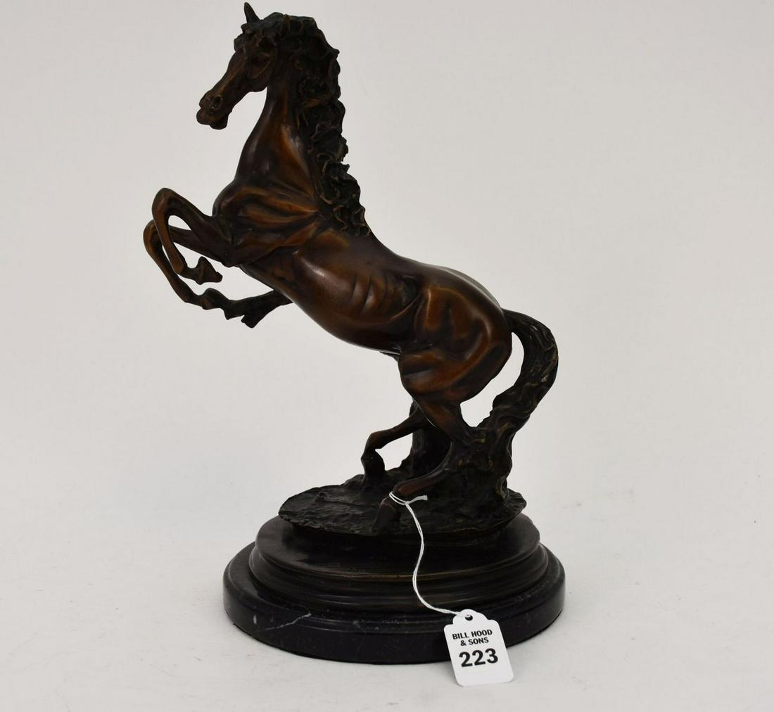 After Emile Pinedo (French, 1840-1916) Bronze Rearing Horse Sculpture - A patinated bronze horse: After Emile Pinedo (French, 1840-1916) Bronze Rearing Horse Sculpture - A patinated bronze horse sculpture after Pinedo. Signed "Pinedo" on base. Atop a black marble round platform base. 12 3/4" h. Co