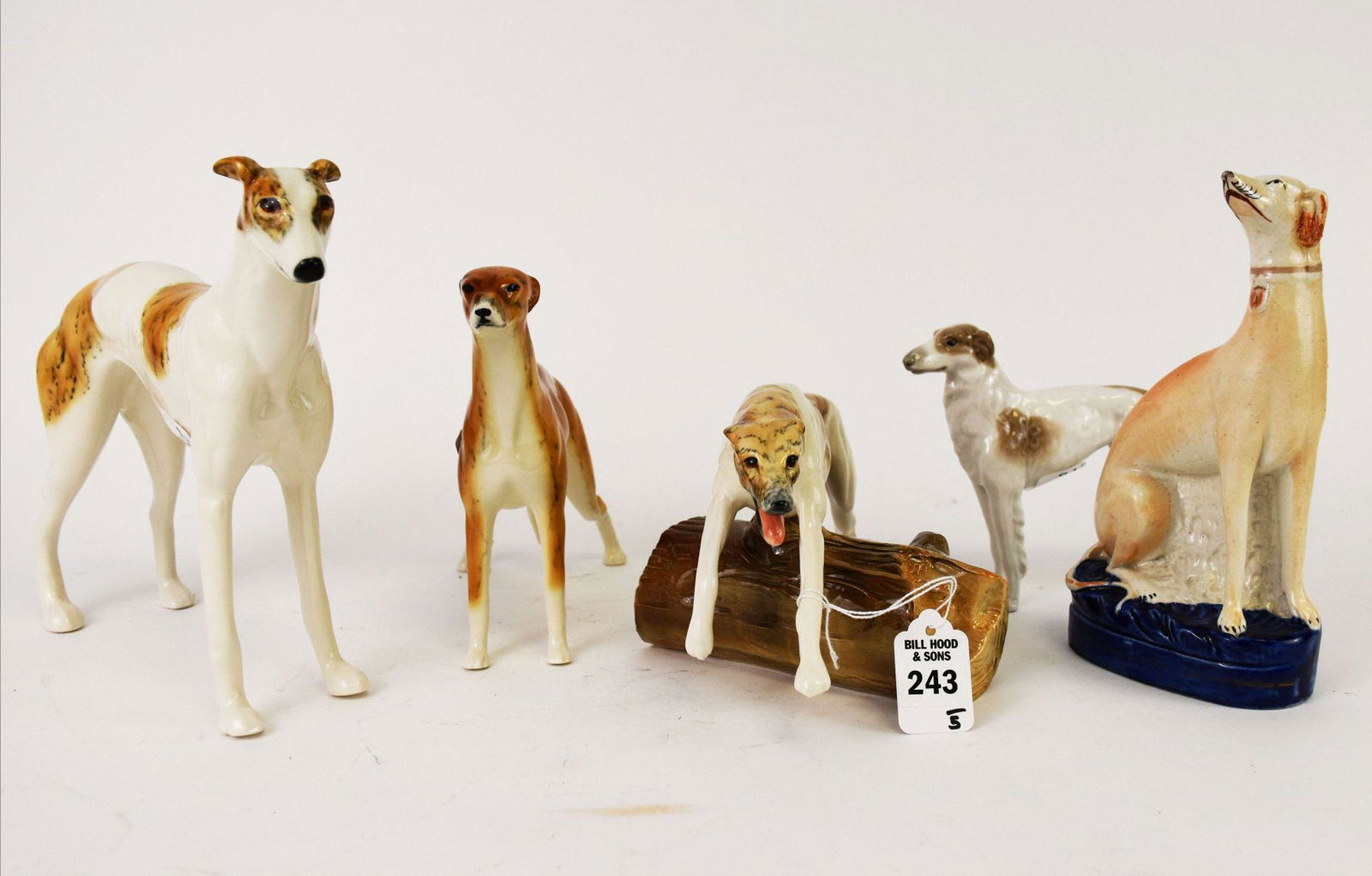 Group of Ceramic Hound Dog Figurines - Grouping of five greyhound and hound figurines comprises: (1 of 5)