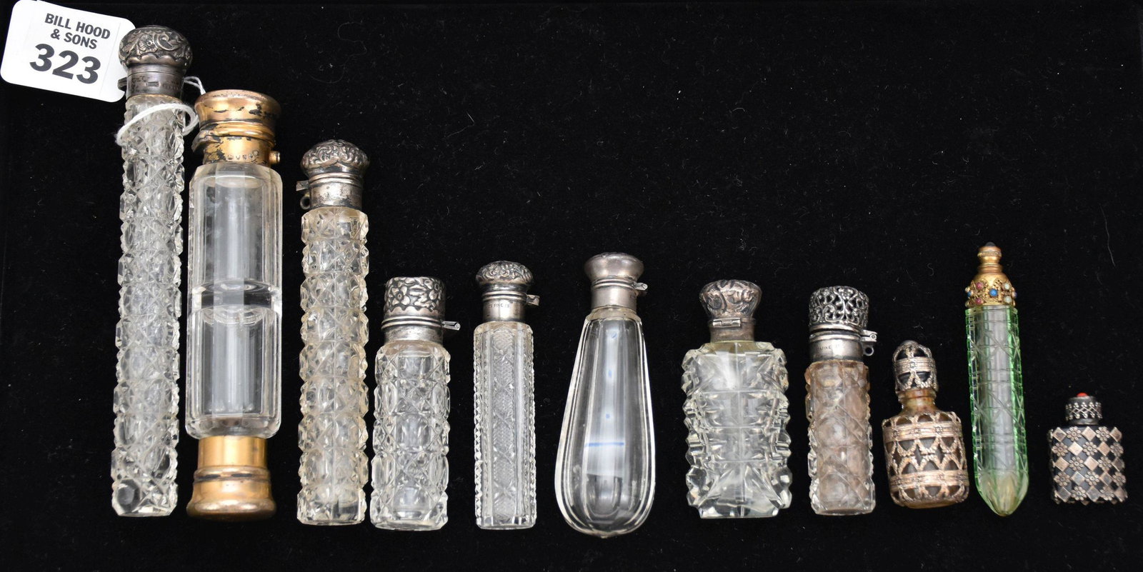 11 Vintage Sterling Lid Scent Perfume Jars. Various sizes 1.25" - 6" in good condition no chips. 2: 11 Vintage Sterling Lid Scent Perfume Jars. Various sizes 1.25" - 6" in good condition no chips. 2 are gold tone all others with sterling lids.