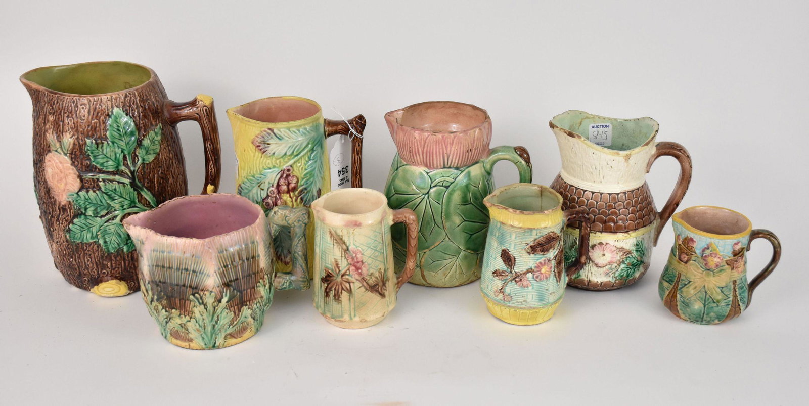 8 Assorted Majolica Pitchers in Various Shapes, Sizes & Colors, 9"h largest (one with nickel size (1 of 7)
