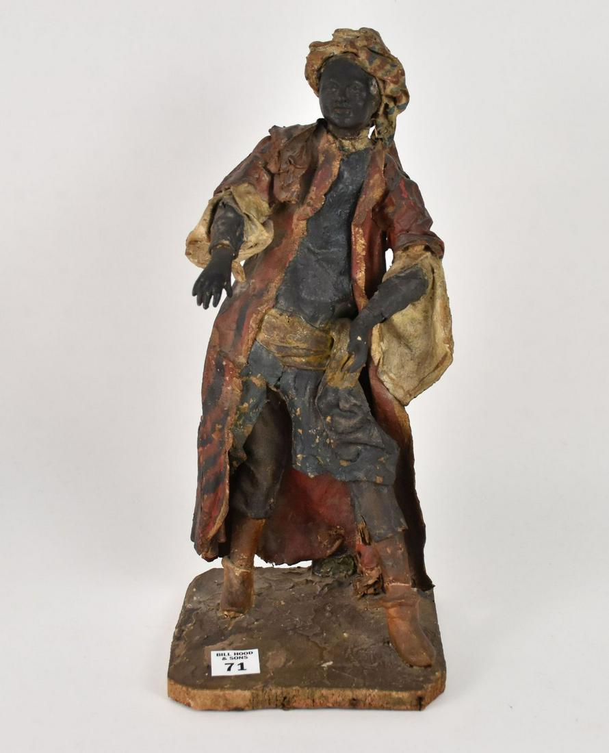 18th c. Moroccan Moorish Attired Figure with Carved Black Face & Hands, Costume is Painted Leather: 18th c. Moroccan Moorish Attired Figure with Carved Black Face & Hands, Costume is Painted Leather or Canvas, Fabric is Brittle and Extremely Fragile, on Wood Base, 14"h
