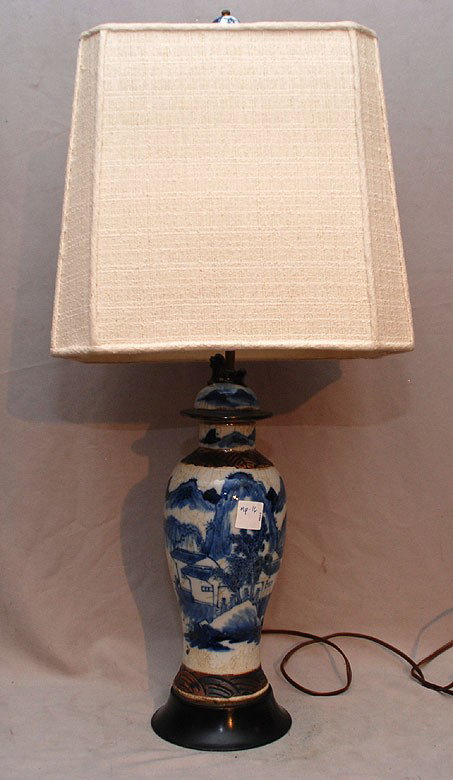Chinese blue and white lamp on attached wooden stan: Chinese blue and white lamp on attached wooden stand, mountains, water fisherman by cottage, porcelain finial, 27" H.